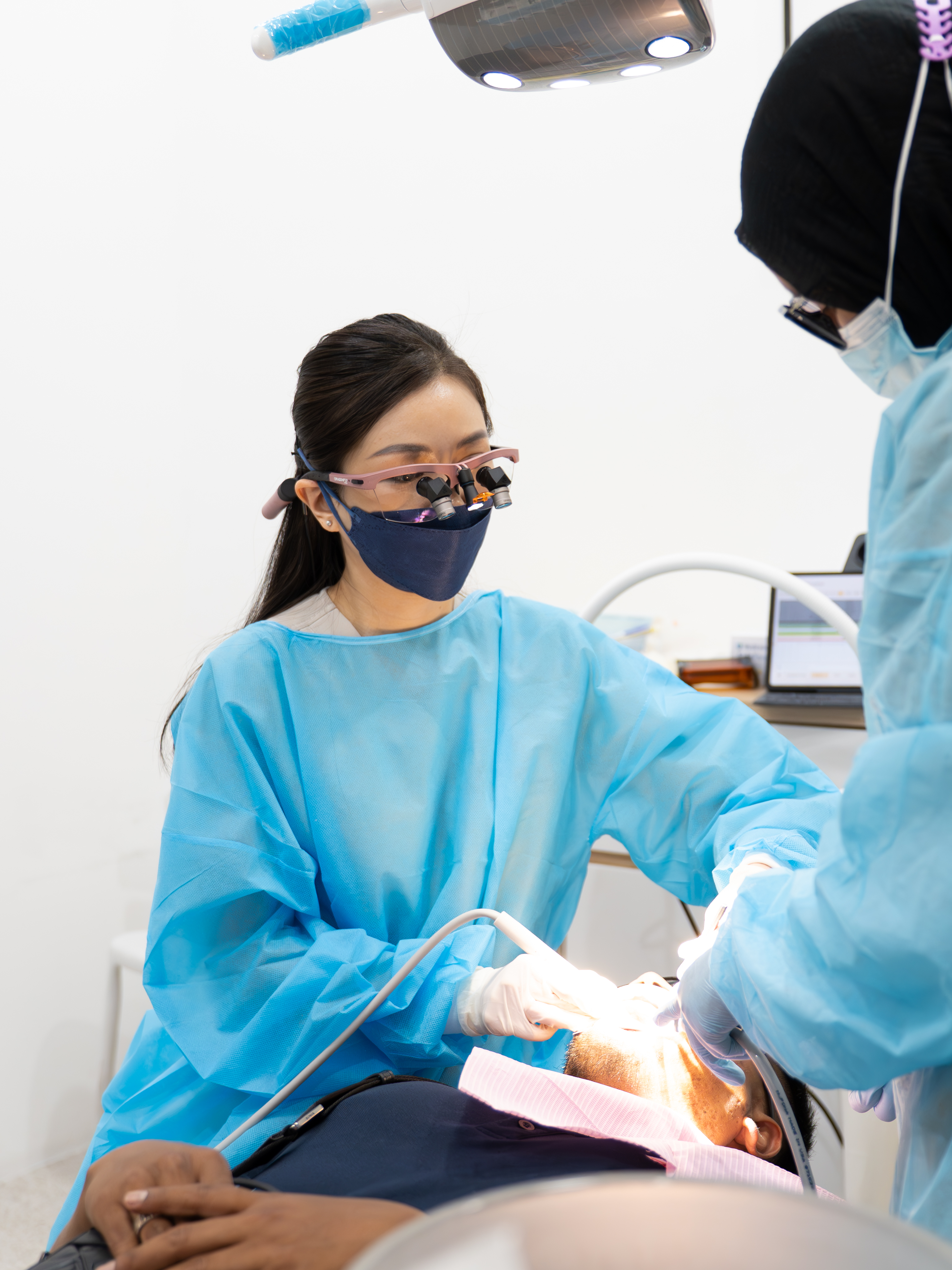 Happy patient with braces in Penang clinic